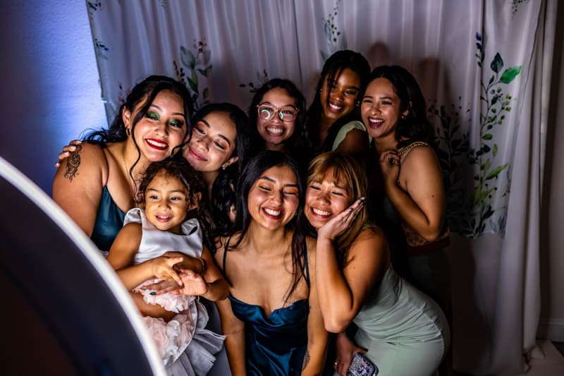 Friends and family laughing together at a celebration