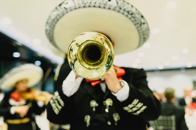 A mariachi musician playing the trumpet